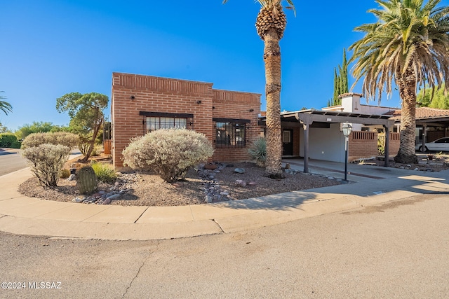 view of front facade with a carport