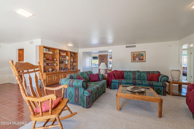 living room featuring tile patterned flooring and plenty of natural light