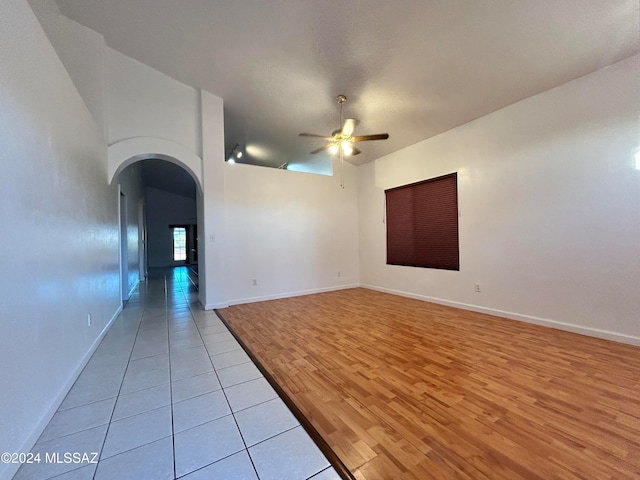 spare room with light hardwood / wood-style floors and ceiling fan