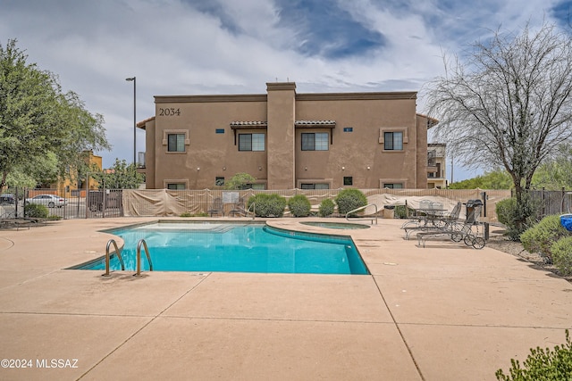 view of swimming pool featuring a patio area