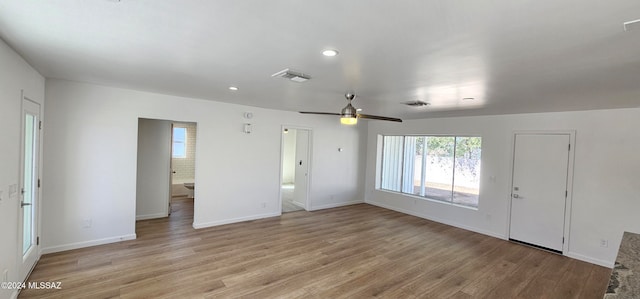 interior space with light wood-type flooring and ceiling fan