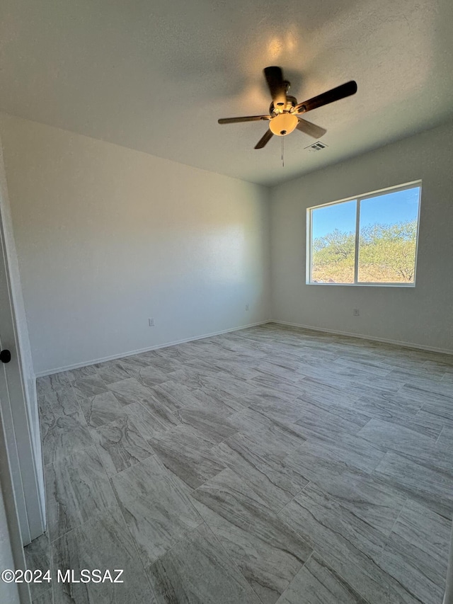 unfurnished room featuring ceiling fan