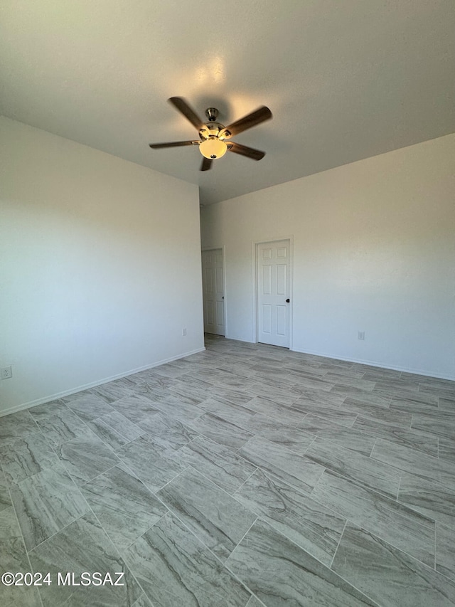 interior space with ceiling fan