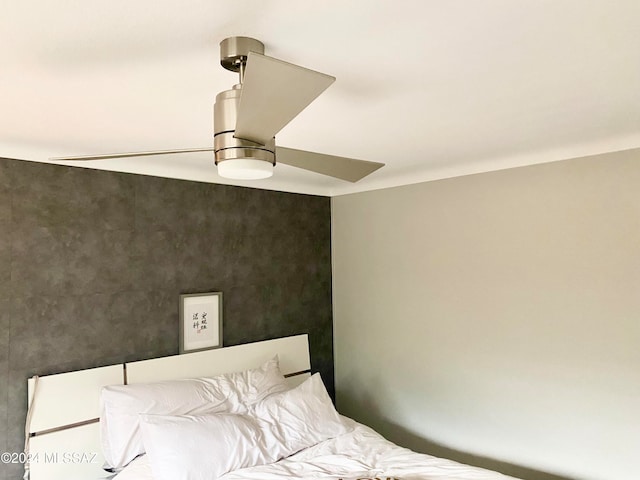 unfurnished bedroom featuring ceiling fan