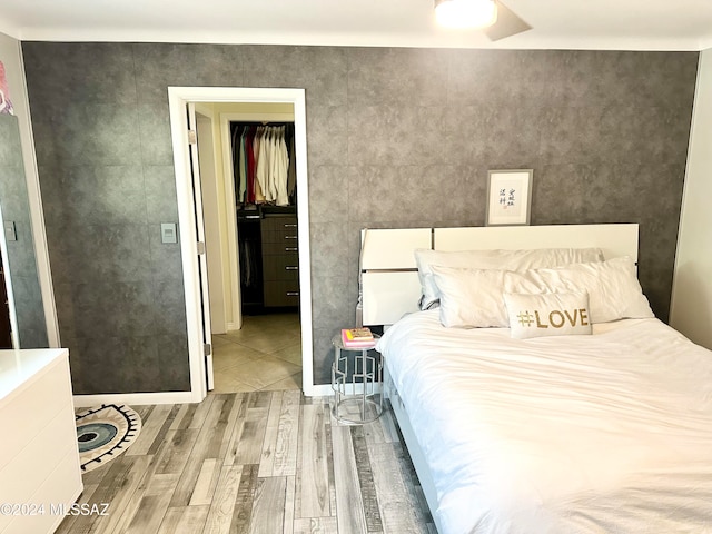 bedroom with a closet and hardwood / wood-style floors