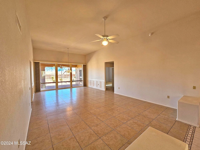 empty room with light tile patterned floors and ceiling fan