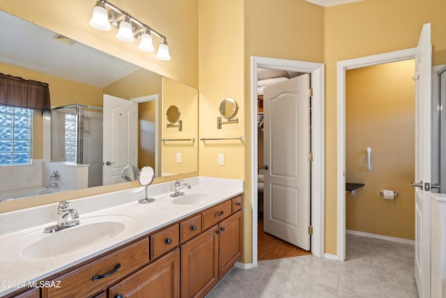 bathroom with tile patterned flooring, vanity, and independent shower and bath