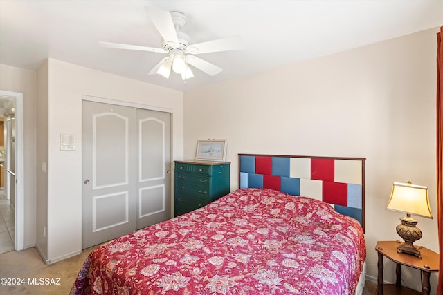 bedroom with carpet flooring, a closet, and ceiling fan