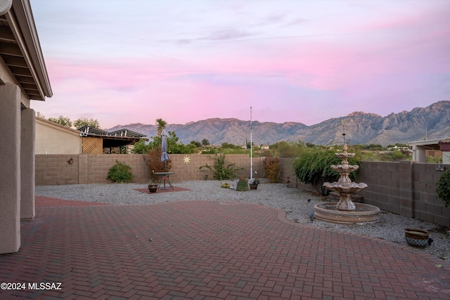 patio terrace at dusk with a mountain view