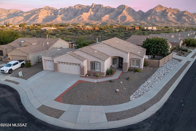 exterior space with a mountain view and a garage