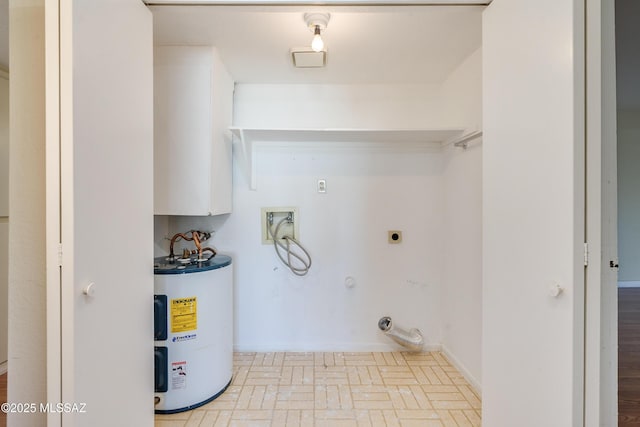 clothes washing area featuring gas dryer hookup, brick floor, hookup for an electric dryer, water heater, and washer hookup