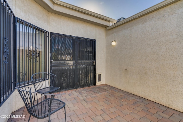 view of patio featuring visible vents