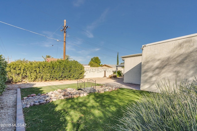 view of yard with fence and a patio