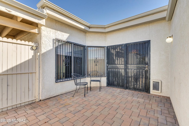 view of patio / terrace with fence and a gate