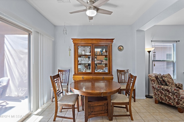 dining area featuring light tile patterned flooring and ceiling fan