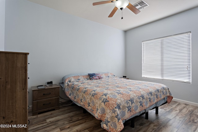 bedroom featuring dark hardwood / wood-style flooring and ceiling fan