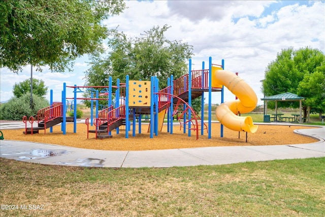 view of playground featuring a lawn