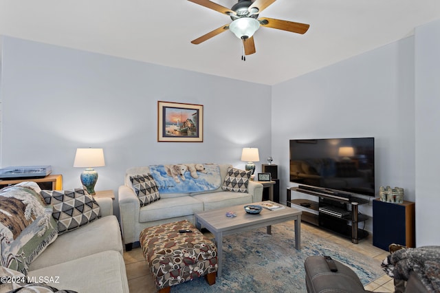 tiled living room featuring ceiling fan