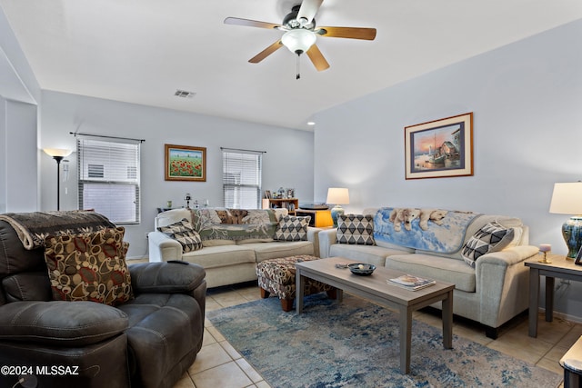 living room with light tile patterned flooring and ceiling fan