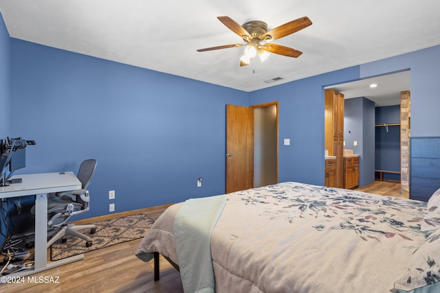 bedroom featuring light wood-type flooring and ceiling fan