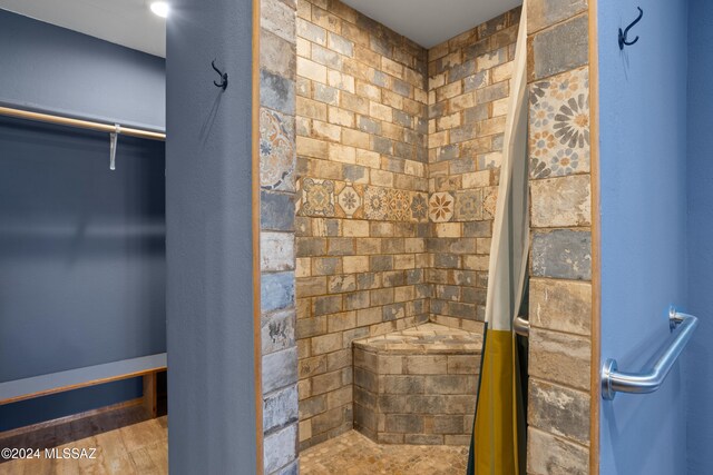 bathroom with hardwood / wood-style flooring