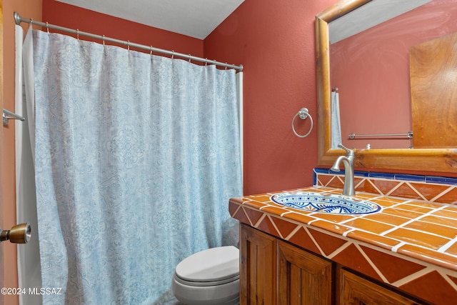 bathroom featuring toilet and sink