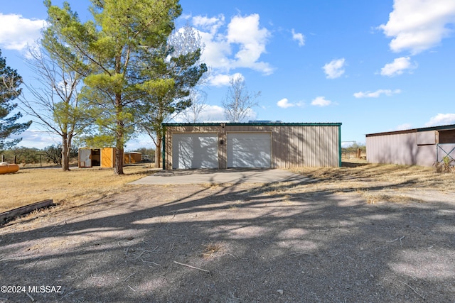 view of outbuilding featuring a garage