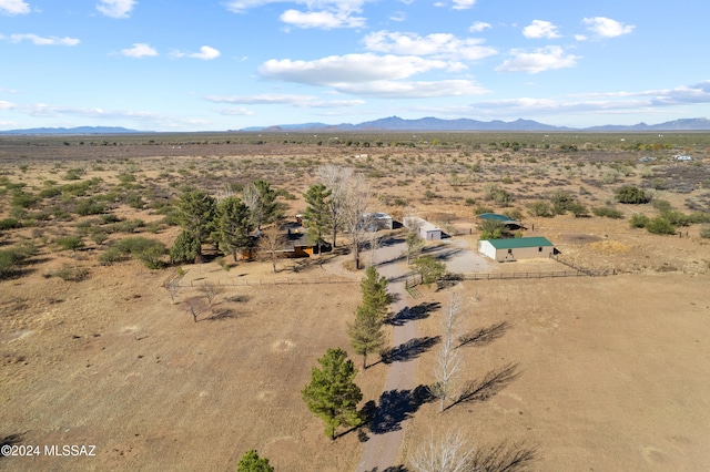 birds eye view of property featuring a mountain view