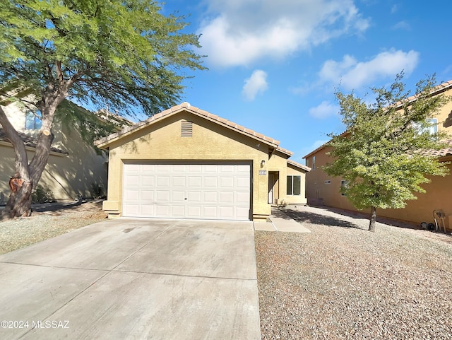 ranch-style house featuring a garage