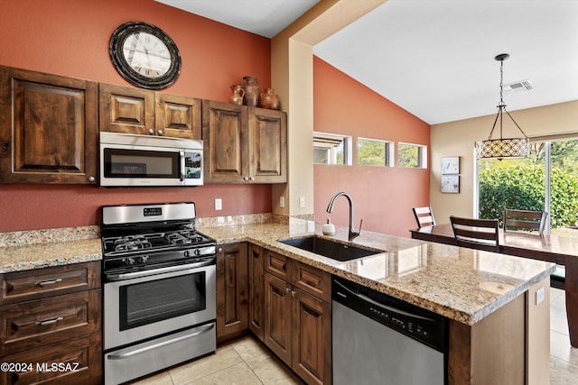 kitchen with sink, plenty of natural light, stainless steel appliances, and kitchen peninsula