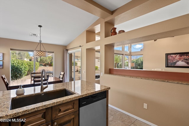 kitchen with sink, light tile patterned floors, hanging light fixtures, light stone countertops, and stainless steel dishwasher