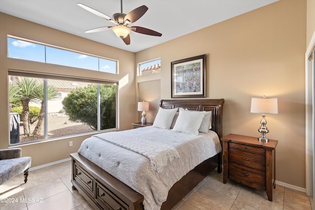 tiled bedroom with ceiling fan