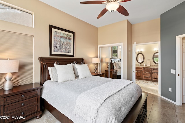 bedroom with ceiling fan, ensuite bathroom, and light tile patterned floors