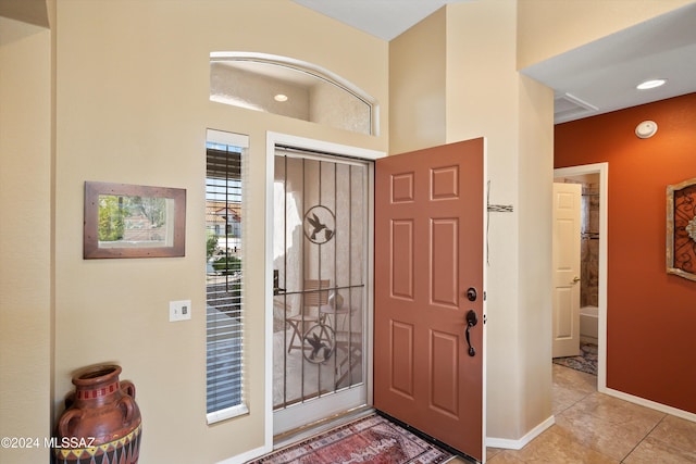 foyer featuring light tile patterned flooring