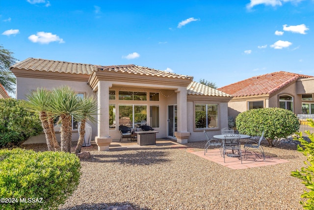 rear view of property with a patio