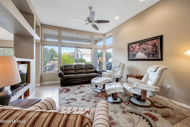 living room featuring ceiling fan and light tile patterned floors