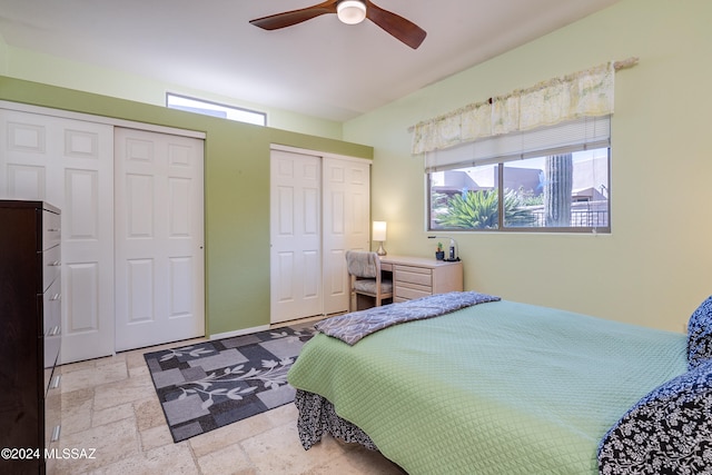 bedroom featuring multiple closets and ceiling fan