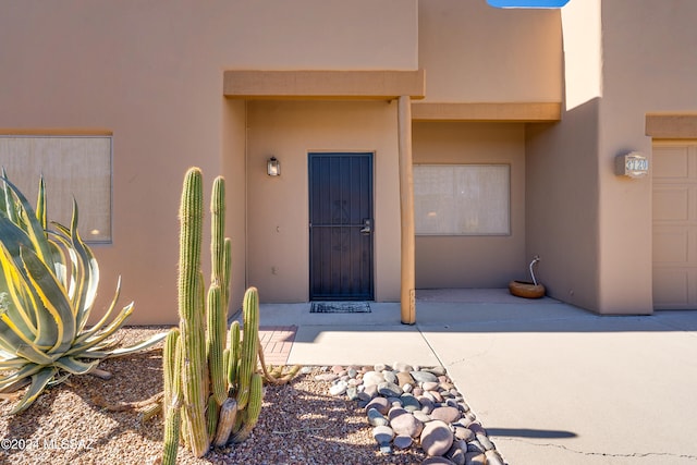 doorway to property featuring a patio area