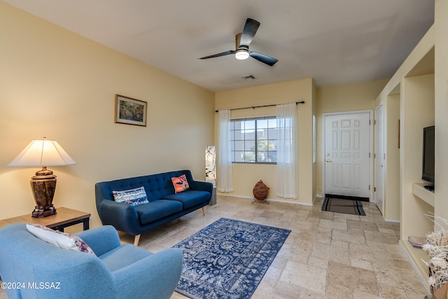 living room featuring ceiling fan