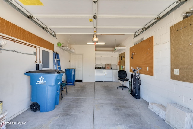 garage featuring washing machine and dryer