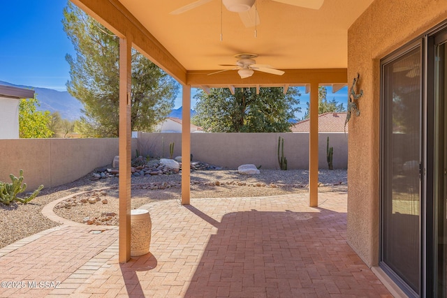 view of patio / terrace with a fenced backyard and ceiling fan