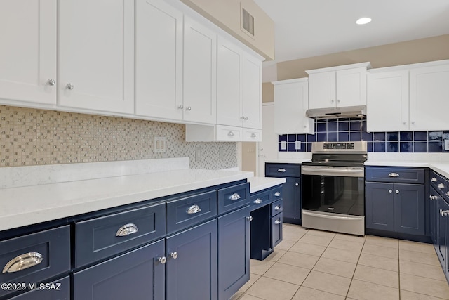 kitchen with electric stove, under cabinet range hood, light countertops, and white cabinets