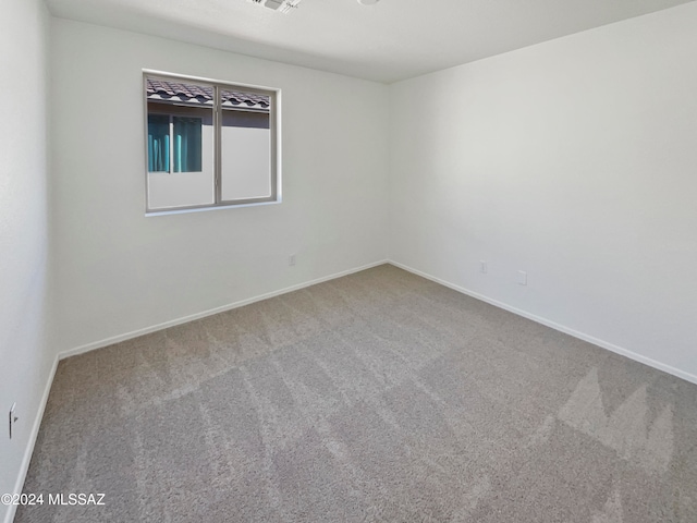 unfurnished room with carpet flooring