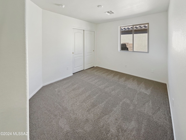 spare room with carpet floors