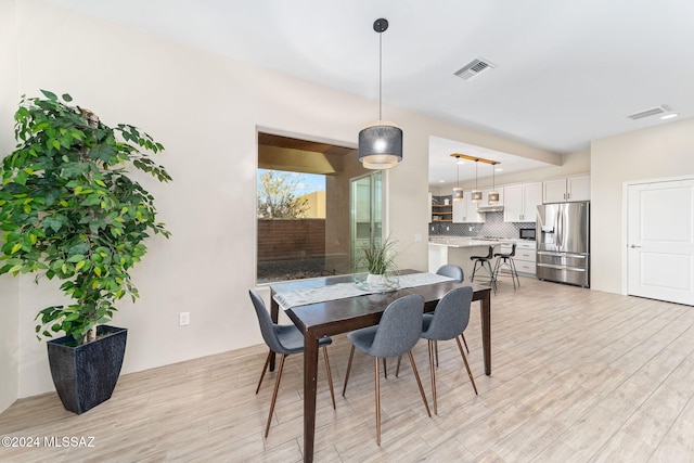 dining room featuring light wood-type flooring