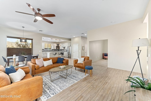 living room with ceiling fan