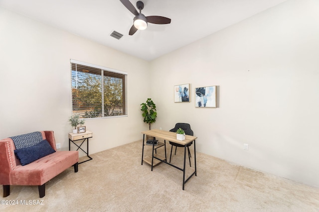 carpeted office featuring ceiling fan