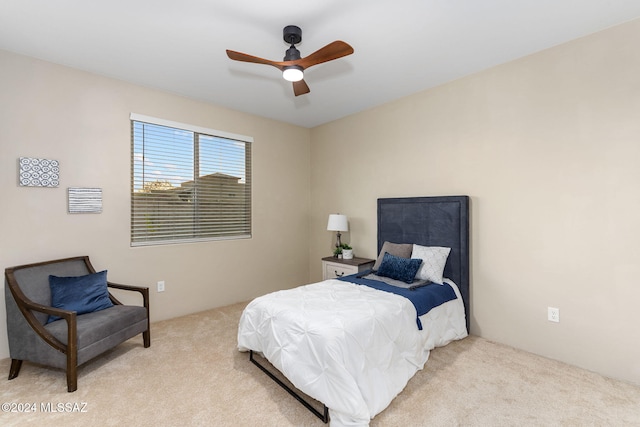 bedroom featuring ceiling fan and light colored carpet