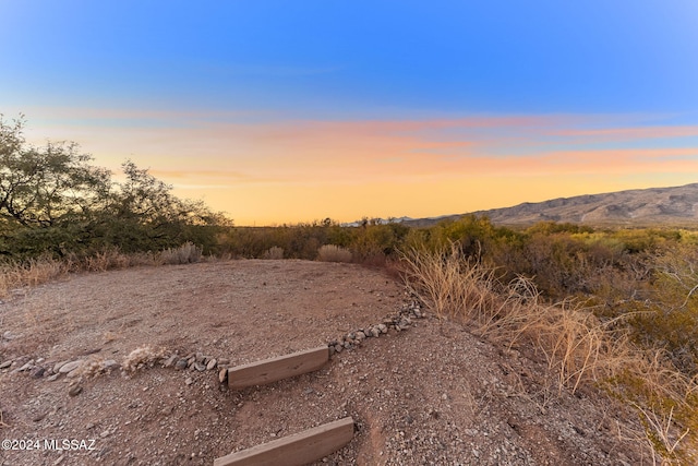 nature at dusk featuring a mountain view