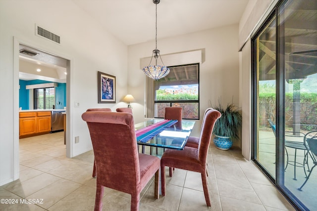 dining space with plenty of natural light and light tile patterned floors